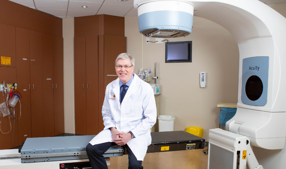 Timothy Whelan sitting in an examination room